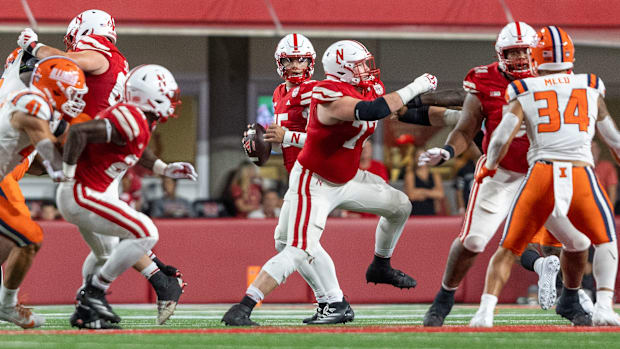 Nebraska quarterback Dylan Raiola sets back to pass against Illinois.