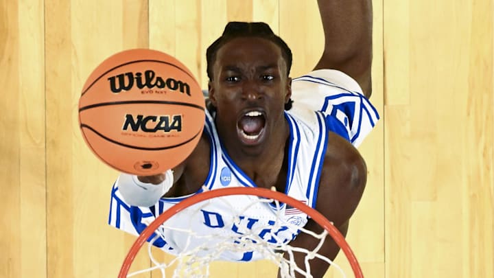 Mar 19, 2026; Greenville, SC, USA; Duke Blue Devils guard Dame Sarr (7) shoots the ball against the Siena Saints in the second half during a first round game of the men's 2026 NCAA Tournament at Bon Secours Wellness Arena. Mandatory Credit: Bob Donnan-Imagn Images