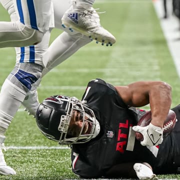 Dec 24, 2023; Atlanta, Georgia, USA; Atlanta Falcons running back Bijan Robinson (7) is tackled just short of the goal line against the Indianapolis Colts during the second half at Mercedes-Benz Stadium. Mandatory Credit: Dale Zanine-USA TODAY Sports