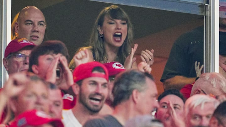 Taylor Swift watches the action during the first half of a game between the Baltimore Ravens and the Kansas City Chiefs at GEHA Field at Arrowhead Stadium.