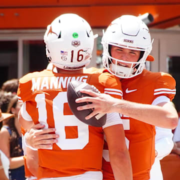 Aug 31, 2024; Austin, Texas, USA; Texas Longhorns quarterback Arch Manning (16) embraces teammate Trey Owens (15) before a game against Colorado State at Darrell K Royal-Texas Memorial Stadium. Mandatory Credit: Aaron Meullion-Imagn Images