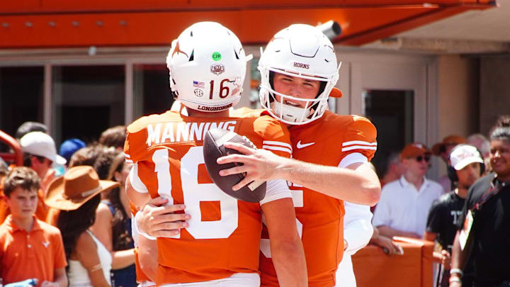 Aug 31, 2024; Austin, Texas, USA; Texas Longhorns quarterback Arch Manning (16) embraces teammate Trey Owens (15) before a game against Colorado State at Darrell K Royal-Texas Memorial Stadium. Mandatory Credit: Aaron Meullion-Imagn Images