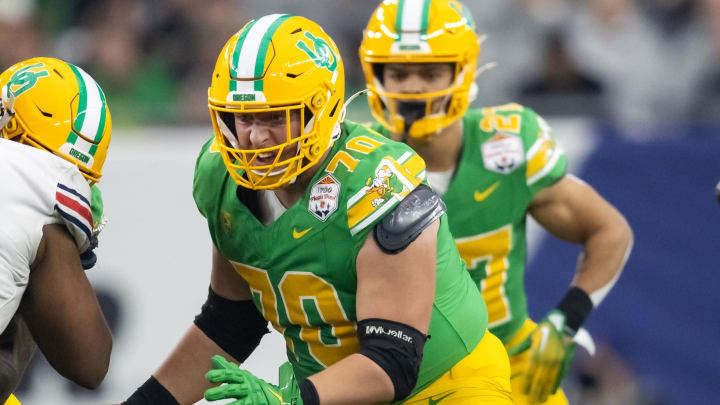 Jan 1, 2024; Glendale, AZ, USA; Oregon Ducks offensive lineman Charlie Pickard (70) against the Liberty Flames during the 2024 Fiesta Bowl at State Farm Stadium. Mandatory Credit: Mark J. Rebilas-USA TODAY Sports