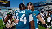 Jacksonville Jaguars quarterback Trevor Lawrence (16) hugs teammate linebacker Travon Walker (44) after Sunday's victory over the Indianapolis Colts. The Jacksonville Jaguars hosted the Indianapolis Colts at EverBank Stadium in Jacksonville, FL Sunday, October 15, 2023. The Jaguars ended the first half with a 21 to 6 lead and won with a final score of 37 to 20.