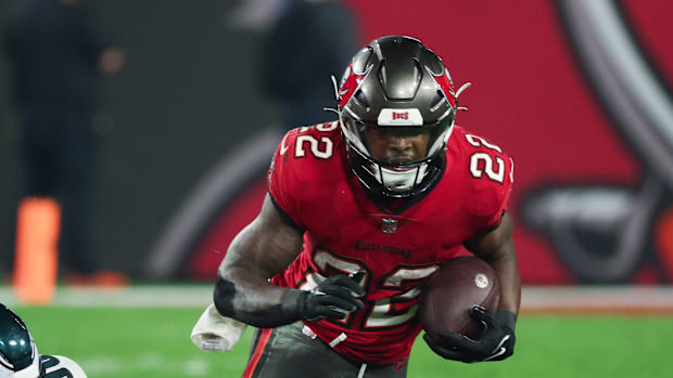 Tampa Bay Buccaneers running back Chase Edmonds (22) is tackled by Philadelphia Eagles defensive tackle Jalen Carter (98)  