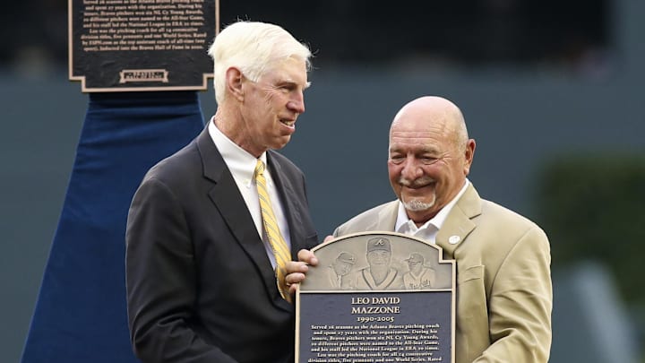 Jul 30, 2022; Atlanta, Georgia, USA; Atlanta Braves chairman Terry McGuirk honors former pitching coach Leo Mazzone during the Braves Hall of fame before a game against the Arizona Diamondbacks at Truist Park. Mandatory Credit: Brett Davis-Imagn Images
