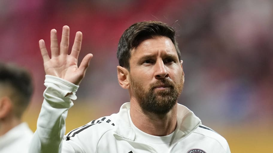 Lionel Messi waving.