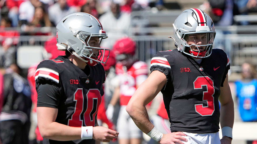 Ohio State Buckeye quarterbacks Julian Sayin (10) and Lincoln Kienholz (3) warm up before the start of the spring game at Ohio Stadium on April 12, 2025.