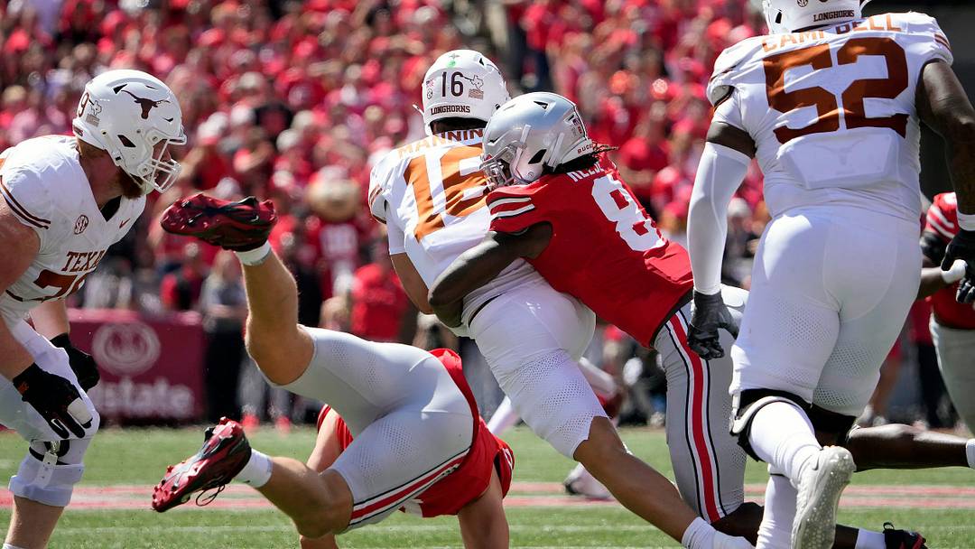 Ohio State Buckeyes linebacker Arvell Reese (8) tackles Texas Longhorns quarterback Arch Manning (16) on a run in the first quarter of their game at Ohio Stadium in Columbus, Ohio on Aug 30, 2025.