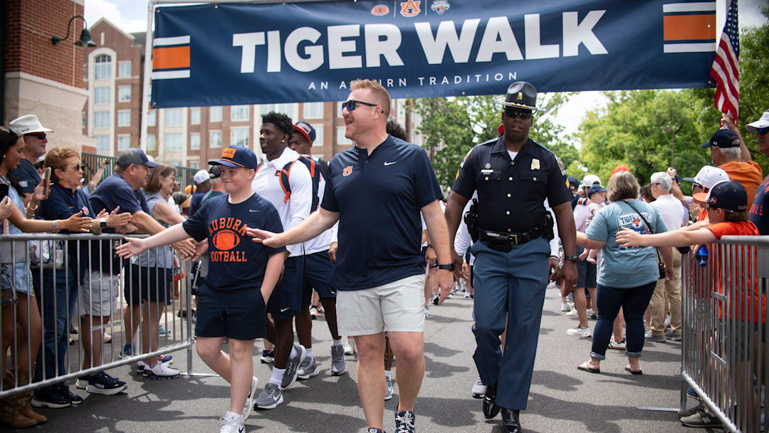 Auburn Tigers head coach Alex Golesh leads his team during Tiger Walk before Auburn Tigers A-Day spring game at Jordan-Hare Stadium in Auburn, Ala. on Saturday, April 18, 2026.