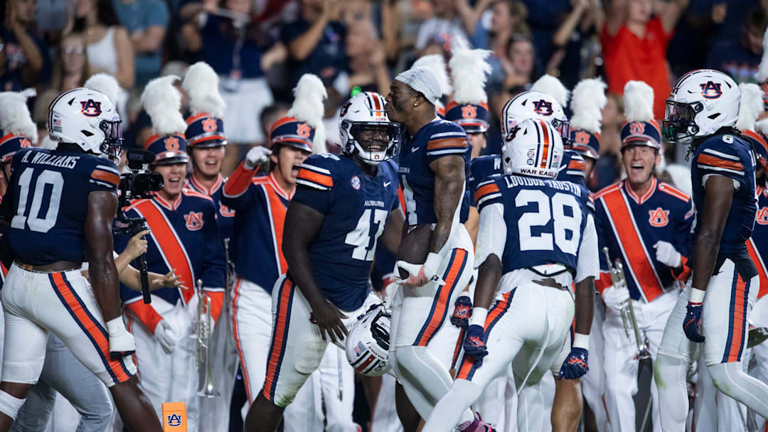 Auburn Tigers defensive back Kayin Lee (4) celebrates his interception as Auburn Tigers take on Missouri Tigers at Jordan-Hare Stadium in Auburn, Ala. on Saturday, Oct. 18, 2025. Missouri Tigers lead Auburn Tigers 10-7 at halftime.