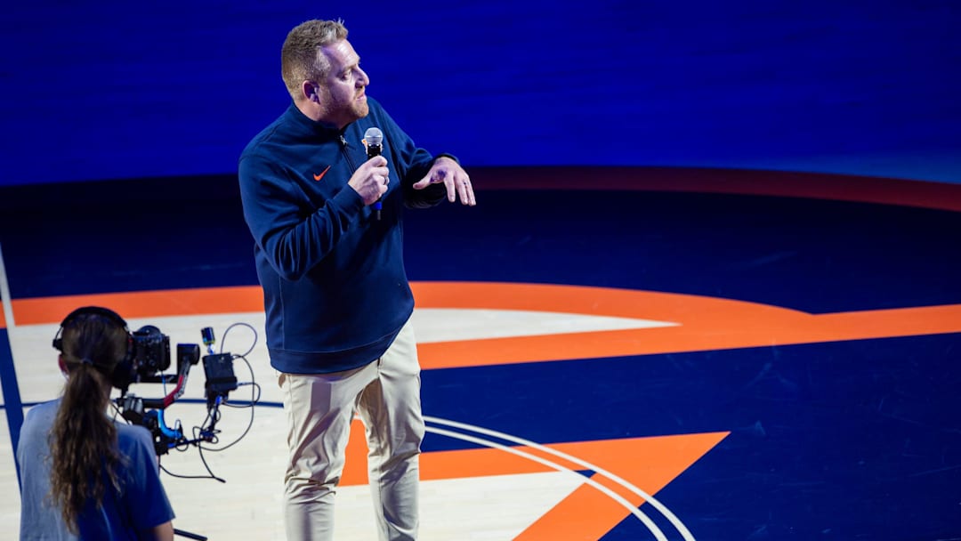 Newly hired Auburn football head coach Alex Golesh talks to fans as Auburn Tigers take on NC State Wolfpack at Neville Arena in Auburn, Ala. on Wednesday, Dec. 3, 2025. Auburn Tigers lead NC State Wolfpack 41-35 at halftime.