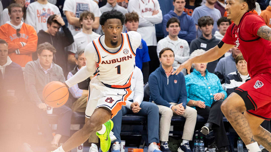 Auburn Tigers guard Kevin Overton (1) drives the ball as Auburn Tigers take on NC State Wolfpack at Neville Arena in Auburn, Ala. on Wednesday, Dec. 3, 2025. Auburn Tigers defeated NC State Wolfpack 83-73.