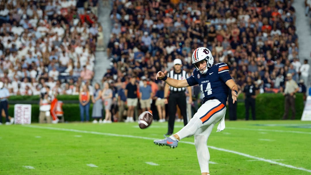 Auburn Tigers punter Hudson Kaak (14) punts the ball as Auburn Tigers take on Missouri Tigers at Jordan-Hare Stadium in Auburn, Ala. on Saturday, Oct. 18, 2025. Missouri Tigers lead Auburn Tigers 10-7 at halftime.