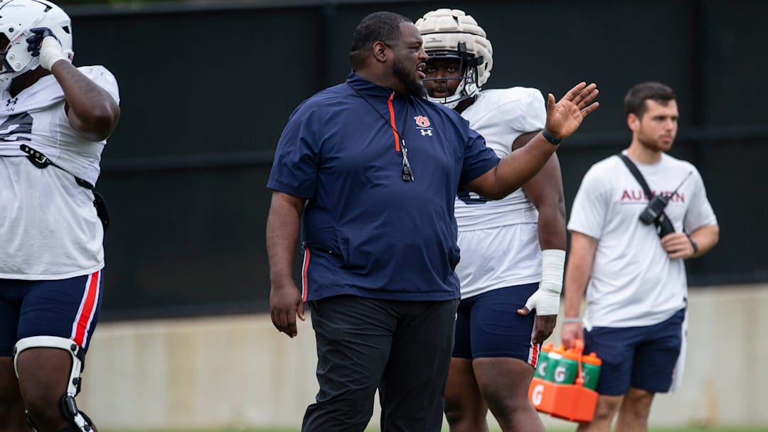 Auburn Tigers defensive tackles coach Vontrell King-Williams talks with players during practice at Woltosz Football Performance Center in Auburn, Ala., on Tuesday, April 2, 2024.