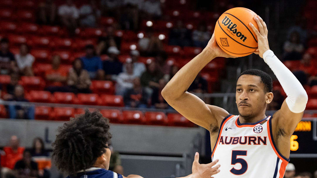 Auburn Tigers guard Kaden Magwood (5) looks to pass as Auburn Tigers take on Nevada Wolfpack during the third round of the National Invitation Tournament at Neville Arena in Auburn, Ala. on Wednesday, March 25, 2026. Auburn Tigers defeated Nevada Wolfpack 75-69.