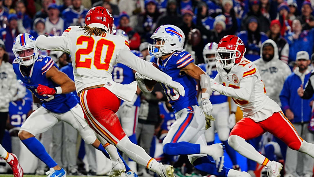 Bills Mack Hollins watches as teammate Khalil Shakir slips between Kansas City's Justine Reid and Nazeeh Johnson for a gain of about five-yards during second half action against the Kansas City Chiefs in Orchard Park, Nov.17, 2024.