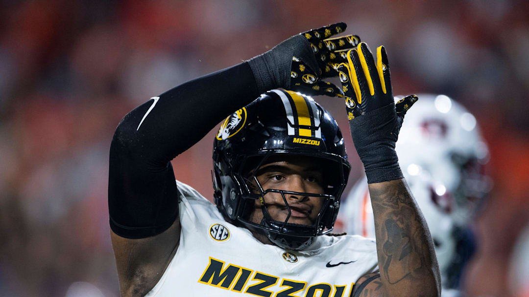 Missouri Tigers defensive tackle Chris McClellan (7) celebrates his sack as Auburn Tigers take on Missouri Tigers at Jordan-Hare Stadium in Auburn, Ala. on Saturday, Oct. 18, 2025. Missouri Tigers lead Auburn Tigers 10-7 at halftime.