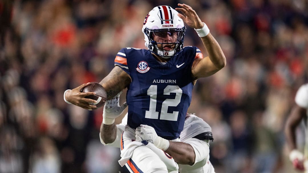 Auburn Tigers quarterback Ashton Daniels (12) runs the ball as Auburn Tigers take on Alabama Crimson Tide in the Iron Bowl at Jordan-Hare Stadium in Auburn, Ala. on Saturday, Nov. 29, 2025. Alabama Crimson Tide leads Auburn Tigers 17-6.