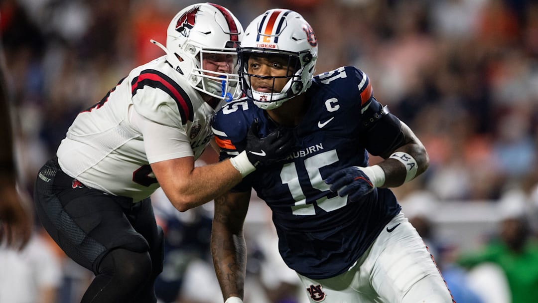 Auburn Tigers defensive end Keldric Faulk (15) blitzes against the Ball State Cardinals at Jordan-Hare Stadium in Auburn, Ala. on Saturday, Sept. 6, 2025.