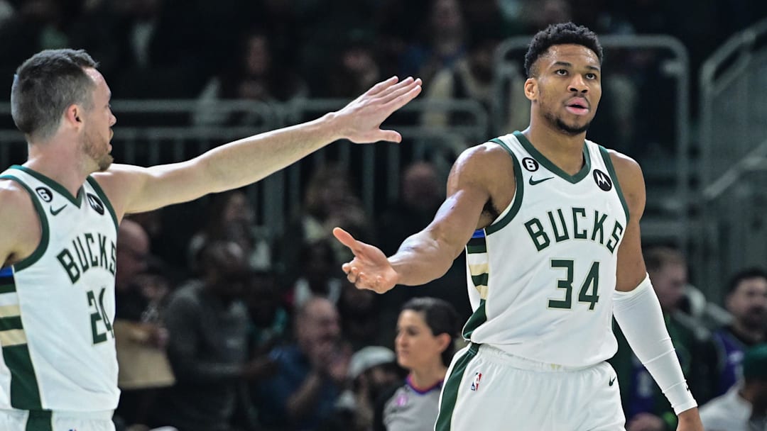 Jan 29, 2023; Milwaukee, Wisconsin, USA; Milwaukee Bucks forward Giannis Antetokounmpo (34) is greeted by guard Pat Connaughton (24) after scoring a basket in the second quarter at Fiserv Forum. Mandatory Credit: Benny Sieu-Imagn Images