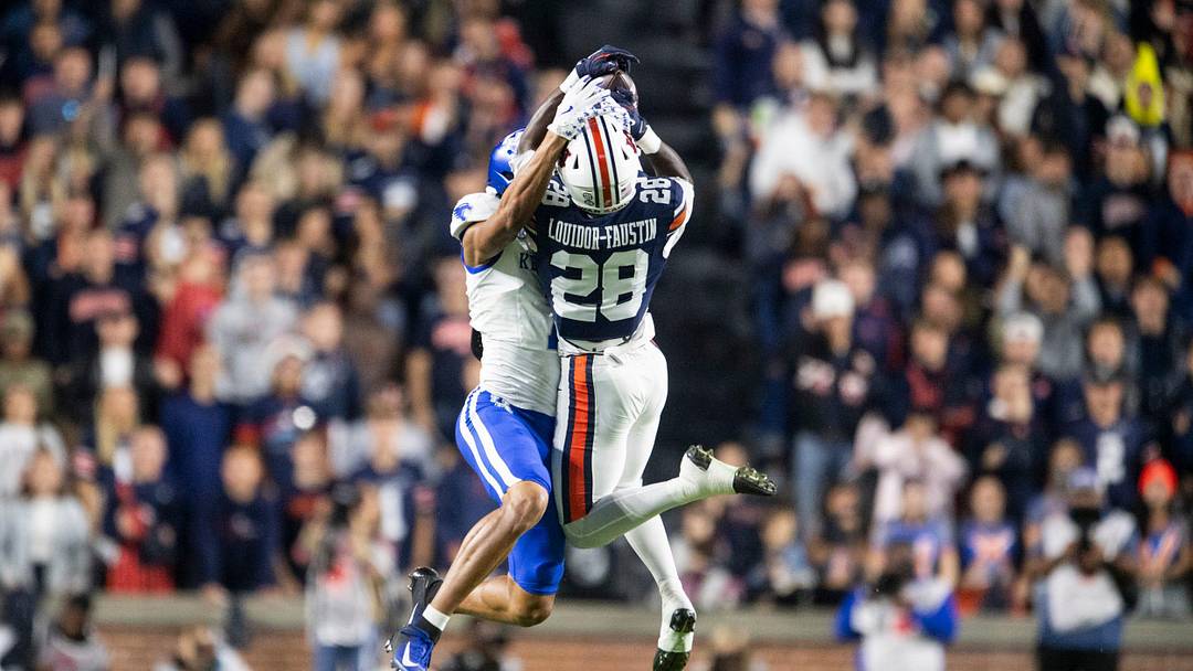 Auburn Tigers safety Kensley Louidor-Faustin (28) breaks up a pass intended for Kentucky Wildcats wide receiver DJ Miller (7) as Auburn Tigers take on Kentucky Wildcats at Jordan-Hare Stadium in Auburn, Ala. on Saturday, Nov. 1, 2025. Kentucky Wildcats defeated Auburn Tigers 10-3.
