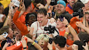 Feb 8, 2025; Clemson, South Carolina, USA; Clemson Tigers sophomore center Viktor Lakhin (0) smiles with fans who rushed the court to celebrate the win over Duke Blue Devils at Littlejohn Coliseum.  