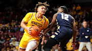 Nov 6, 2024; Minneapolis, Minnesota, USA; Minnesota Golden Gophers guard Lu'Cye Patterson (25) works around Oral Roberts Golden Eagles guard Jalen Miller (12) during the first half at Williams Arena. Mandatory Credit: Matt Krohn-Imagn Images
