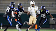 Moody's Josiah Dozier (1) runs the ball during the Class 5A football state championship at Protective Stadium in Birmingham, Ala., on Thursday, Dec. 5, 2024. Montgomery Catholic leads Moody 14-0 at halftime.