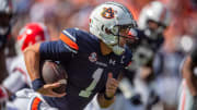 Auburn Tigers quarterback Payton Thorne breaks free for a long run against the Georgia Bulldogs