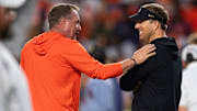 Auburn Tigers head coach Hugh Freeze and Missouri Tigers head coach Eli Drinkwitz talk during warm ups before Auburn Tigers take on Missouri Tigers at Jordan-Hare Stadium in Auburn, Alabama