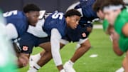 Auburn Tigers defensive end Keldric Faulk runs drills during practice at Woltosz Football Performance Center