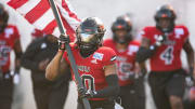 Northern Illinois Huskies wide receiver Billy Dozier (10) leads his team on the field as Arkansas State Red Wolves take on the Northern Illinois Huskies during the Camellia Bowl at Cramton Bowl in Montgomery, Ala., on Saturday, Dec. 23, 2023. Northern Illinois Huskies leads Arkansas State Red Wolves 21-13.
