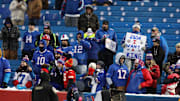Bills fans watch as the team warms up out of uniform.