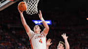 Feb 8, 2025; Clemson, South Carolina, USA; Clemson Tigers forward Ian Schieffelin (4) scores near Duke Blue Devils guard Kon Knueppel (7) during the first half at Littlejohn Coliseum. Mandatory Credit: Ken Ruinard/USA Today Network via magn Images
