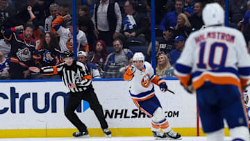 Feb 1, 2025; Tampa, Florida, USA; New York Islanders defenseman Tony DeAngelo (4) celebrates after scoring a goal against the Tampa Bay Lightning in overtime at Amalie Arena. Mandatory Credit: Nathan Ray Seebeck-Imagn Images