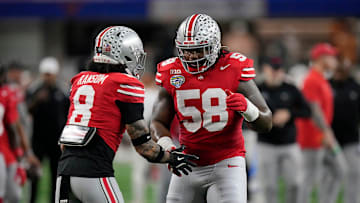 Ohio State Buckeyes safety Lathan Ransom (8) and Ohio State Buckeyes defensive tackle Ty Hamilton (58) do a hand shake during final warm ups at the Cotton Bowl Classic before their game against Texas Longhorns in the College Football Playoff semifinal game at AT&T Stadium in Arlington, Texas on January, 10, 2025.