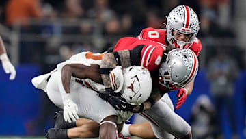 Ohio State Buckeyes safety Lathan Ransom (8) tackles Texas Longhorns running back Quintrevion Wisner (26) in the third quarter of the Cotton Bowl Classic during the College Football Playoff semifinal game at AT&T Stadium in Arlington, Texas on January, 10, 2025.