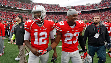 Ohio State Buckeyes safety Tyvis Powell (23) and Ohio State Buckeyes quarterback Cardale Jones (12) celebrate their win over Michigan Wolverines at Ohio Stadium in Columbus, Ohio on November 29, 2014.  (Dispatch photo by Kyle Robertson)

Osu14um Kr 39