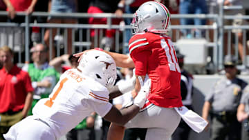 Ohio State Buckeyes quarterback Julian Sayin (10) throws the ball against Texas Longhorns linebacker Colin Simmons (1) in the second quarter of their game at Ohio Stadium in Columbus, Ohio on Aug 30, 2025.