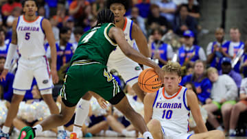 USF guard Kobe Knox (4) will join teammates C.J. Brown and Jayden Reid in the transfer portal.