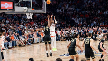 Auburn Tigers guard Miles Kelly (13) takes a jump shot as Auburn Tigers take on Purdue Boilermakers at Legacy Arena in Birmingham, Ala., on Saturday, Dec. 21, 2024. Auburn Tigers lead Purdue Boilermakers 41-26 at halftime.