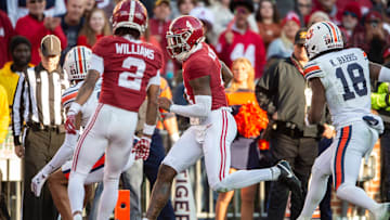 Alabama Crimson Tide quarterback Jalen Milroe (4) runs the ball into the end zone for a touchdown as Auburn Tigers take on Alabama Crimson Tide at Bryant-Denny Stadium in Tuscaloosa, Ala., on Saturday, Nov. 30, 2024. Alabama Crimson Tide leads Auburn Tigers 14-6 at halftime.