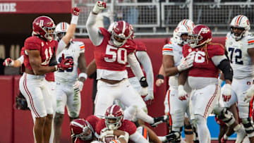 Auburn Tigers running back Jarquez Hunter (27) is stopped during an Alabama Crimson Tide goal line stand at the end of the first half as Auburn Tigers take on Alabama Crimson Tide at Bryant-Denny Stadium in Tuscaloosa, Ala., on Saturday, Nov. 30, 2024. Alabama Crimson Tide leads Auburn Tigers 14-6 at halftime.