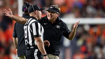 Georgia Bulldogs head coach Kirby Smart talks with an official as Auburn Tigers take on Georgia Bulldogs at Jordan-Hare Stadium in Auburn, Ala. on Saturday, Oct. 11, 2025. Georgia Bulldogs defeated Auburn Tigers 20-10.