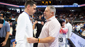 Florida coach Todd Golden, left, and Auburn coach Bruce Pearl talk before their game at Neville Arena in Auburn, Ala., on Saturday, Feb. 8, 2025.