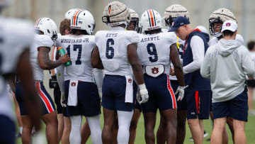 Auburn Tigers defensive coordinator DJ Durkin huddles with players during practice at Woltosz Football Performance Center in Auburn, Ala., on Tuesday, April 2, 2024.