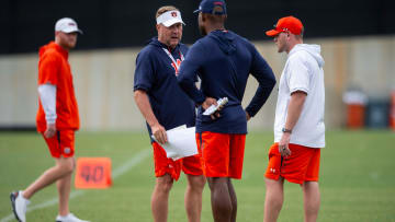 Auburn Tigers head coach Hugh Freeze talks with offensive coordinator Derrick Nix during practice at Woltosz Football Performance Center in Auburn, Ala., on Tuesday, April 2, 2024.