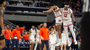 Auburn Tigers guard Chaney Johnson (31) and Auburn Tigers guard Denver Jones (12) celebrate basket as Auburn Tigers take on Mississippi State Bulldogs at Neville Arena in Auburn, Ala., on Saturday, March 2, 2024. Auburn Tigers defeated Mississippi State Bulldogs 78-63.