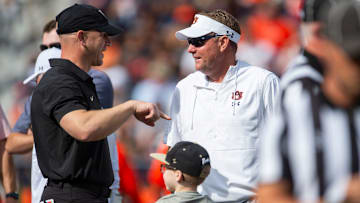Vanderbilt Commodores head coach Clark Lea and Auburn Tigers head coach Hugh Freeze talk with Lea’s son, Jack, during warm ups as Auburn Tigers take on Vanderbilt Commodores at Jordan-Hare Stadium in Auburn, Ala., on Saturday, Nov. 2, 2024.